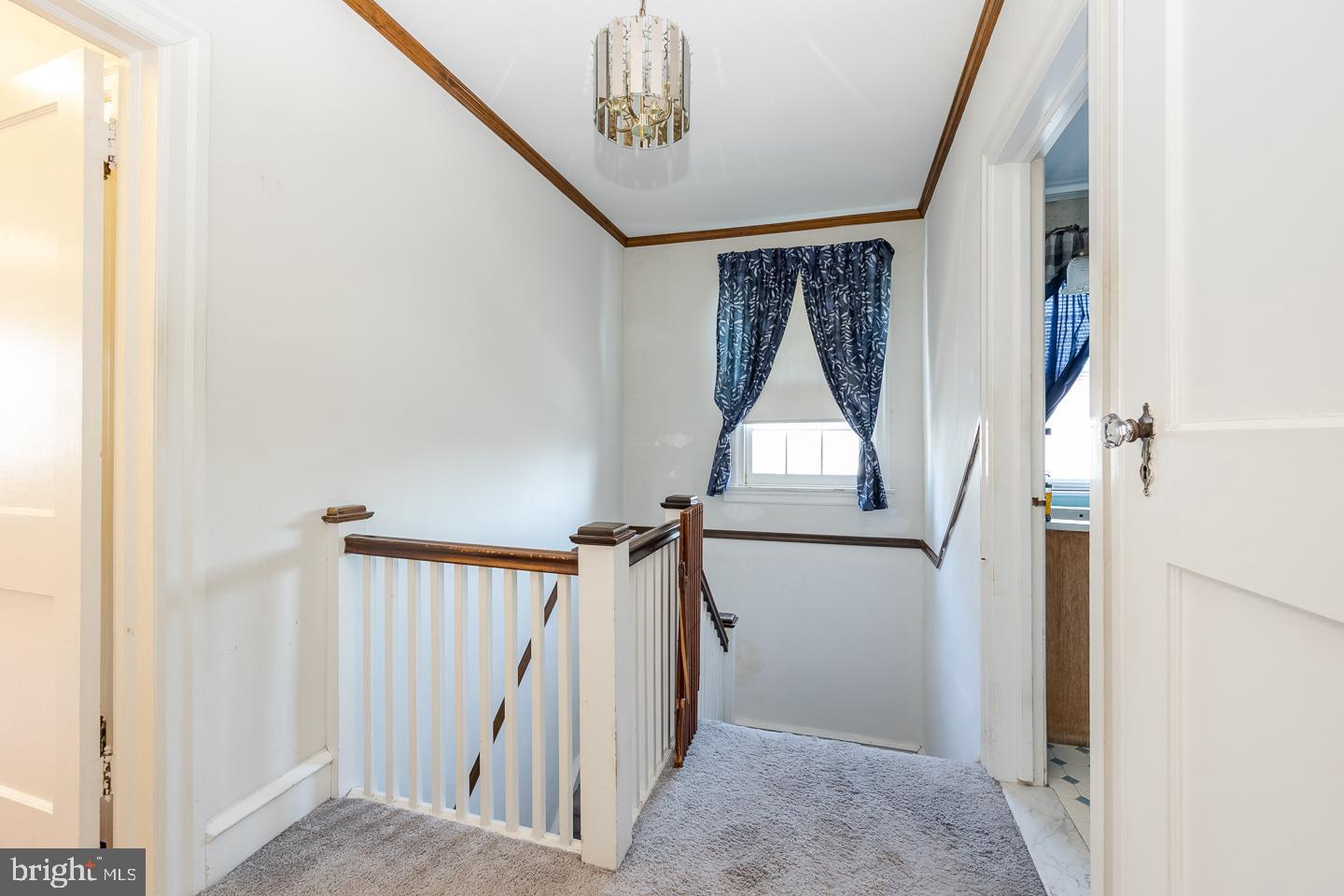 107 Crestview Road Upper Darby, PA 19082 - Photo 15 of 21 a view of a hallway with windows and stairs