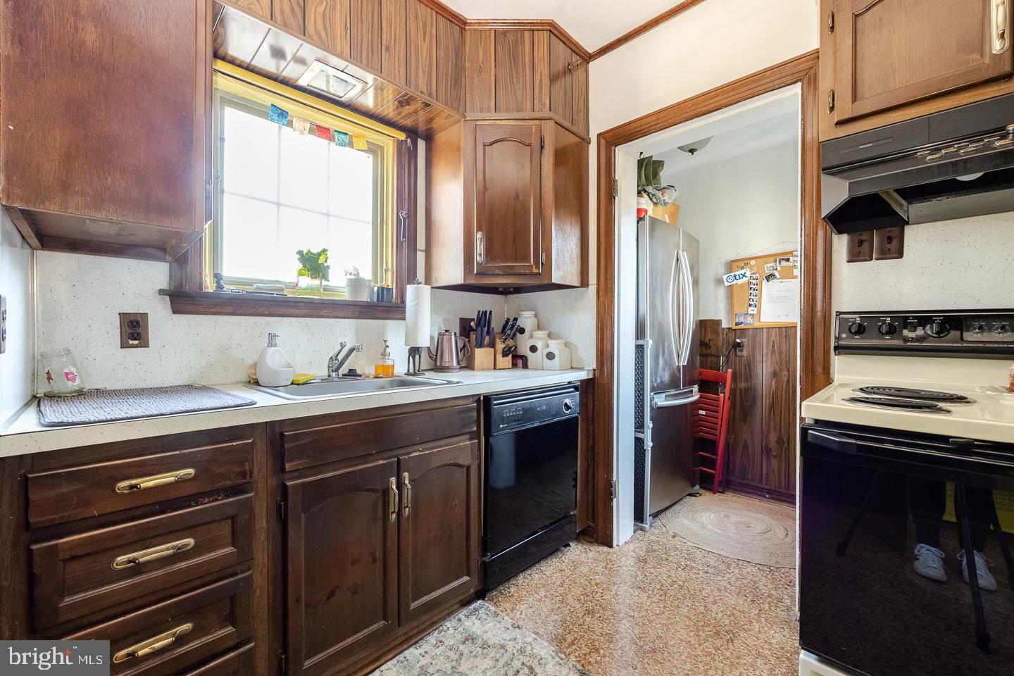 107 Crestview Road Upper Darby, PA 19082 - Photo 20 of 21 a kitchen with a sink stove and cabinets