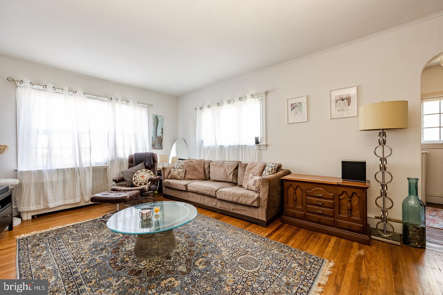 107 Crestview Road Upper Darby, PA 19082 - Photo 3 of 21 a living room with furniture a couch and a window