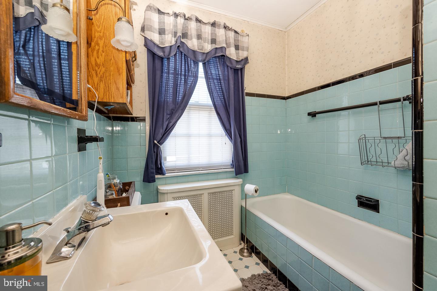107 Crestview Road Upper Darby, PA 19082 - Photo 7 of 21 a bathroom with a sink a toilet and bathtub