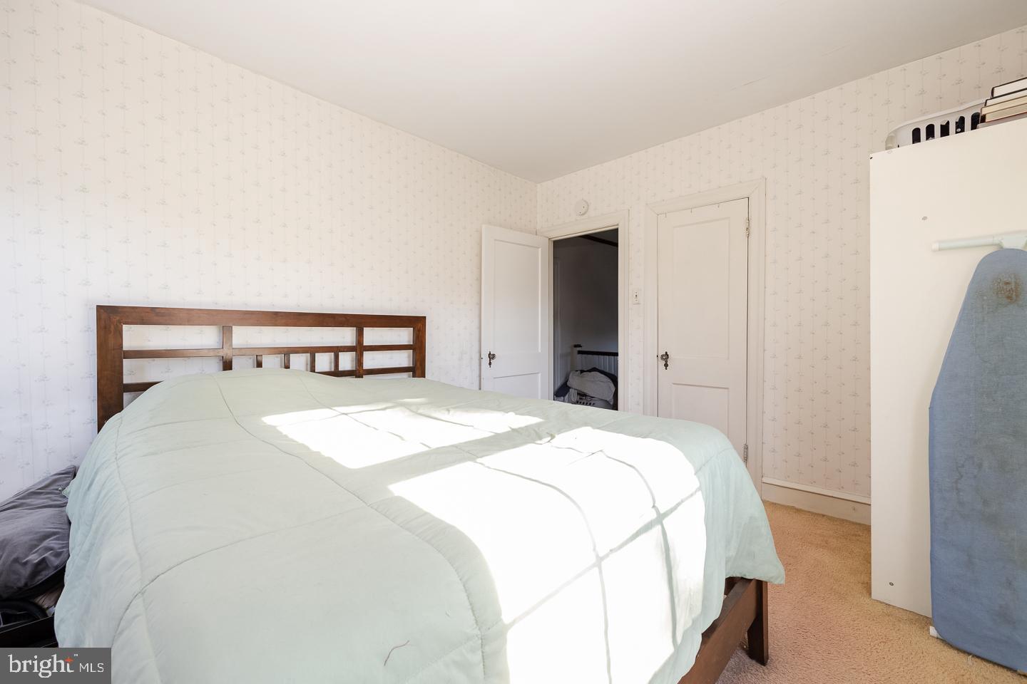 107 Crestview Road Upper Darby, PA 19082 - Photo 9 of 21 a bedroom with a bed and a table