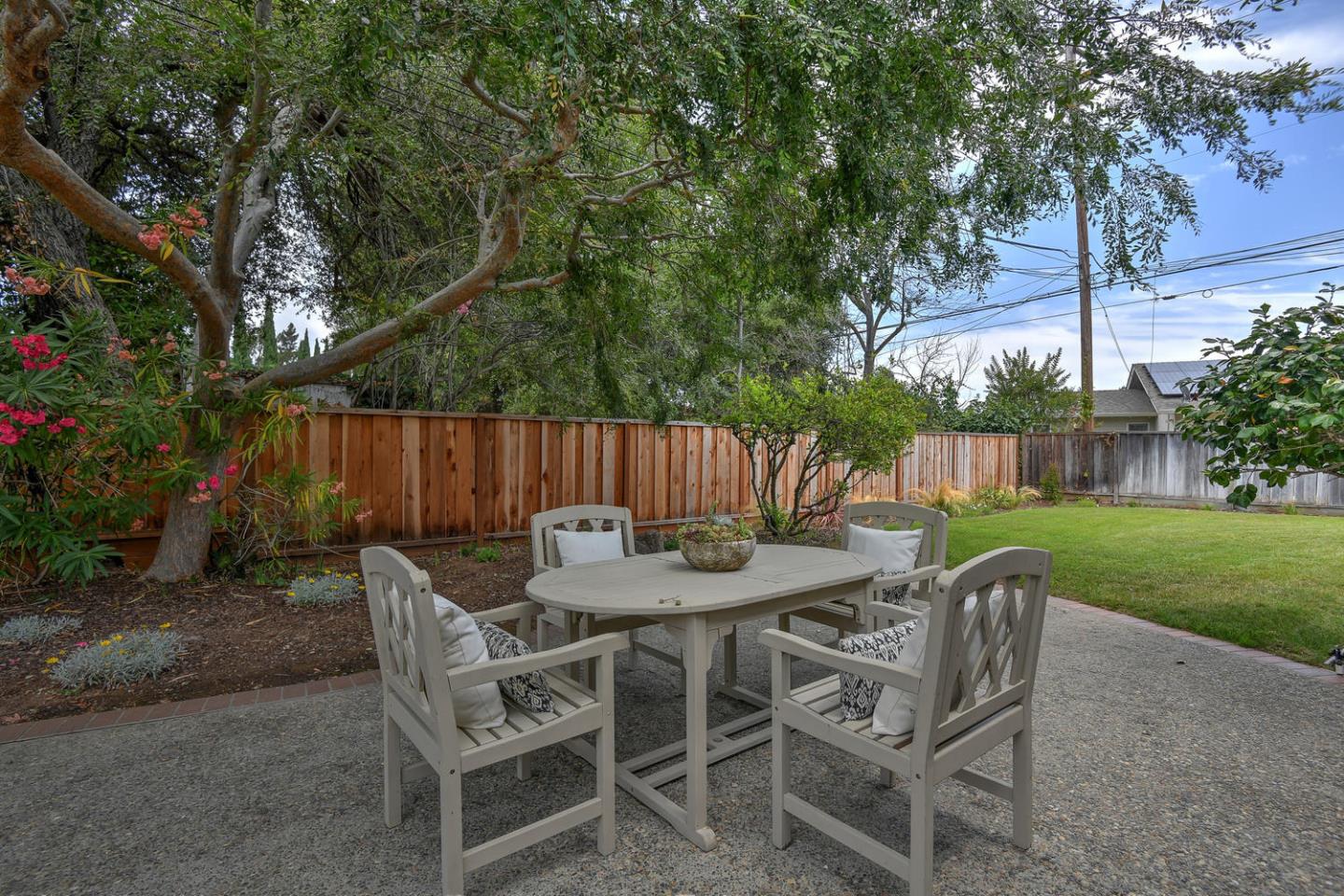 45 Stuart Court Los Altos, CA 94022 - Photo 5 of 10 a view of a dining table and chairs in the garden