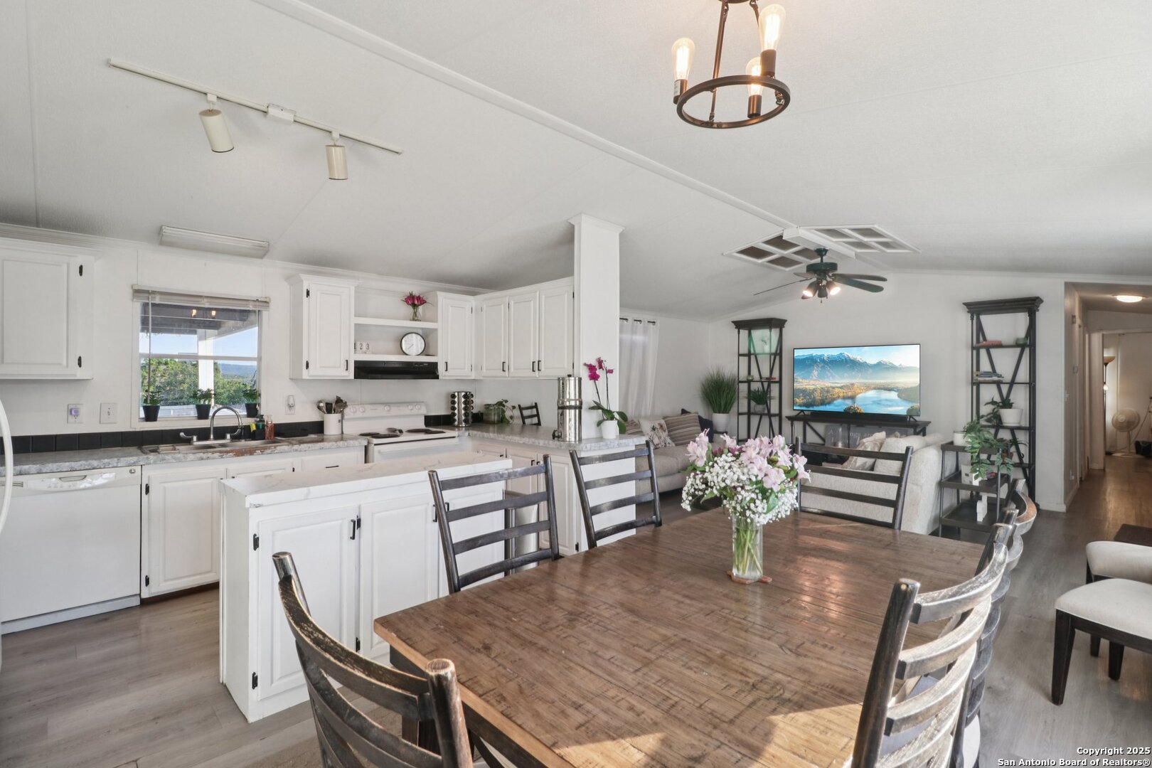 160 Deer View Road Pipe Creek, TX 78063 - Photo 17 of 55 a large kitchen with a table and chairs in it