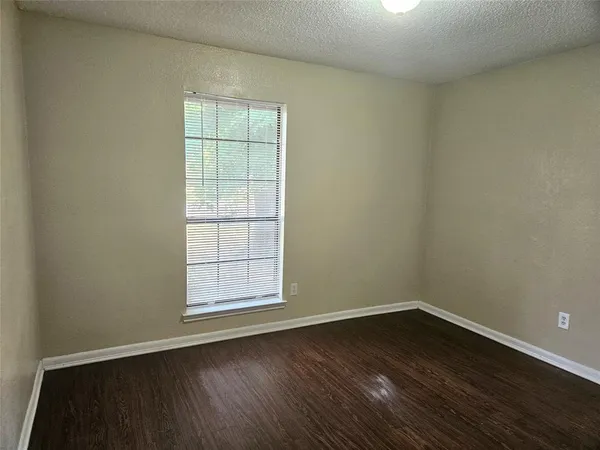 a view of a house with a tree