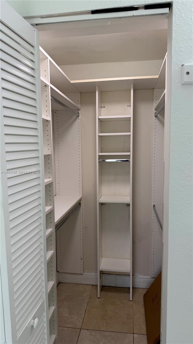 3901 Southwest 109th Avenue, Unit 4 Miami, FL 33165 - Photo 13 of 15 a view of an empty walk in closet