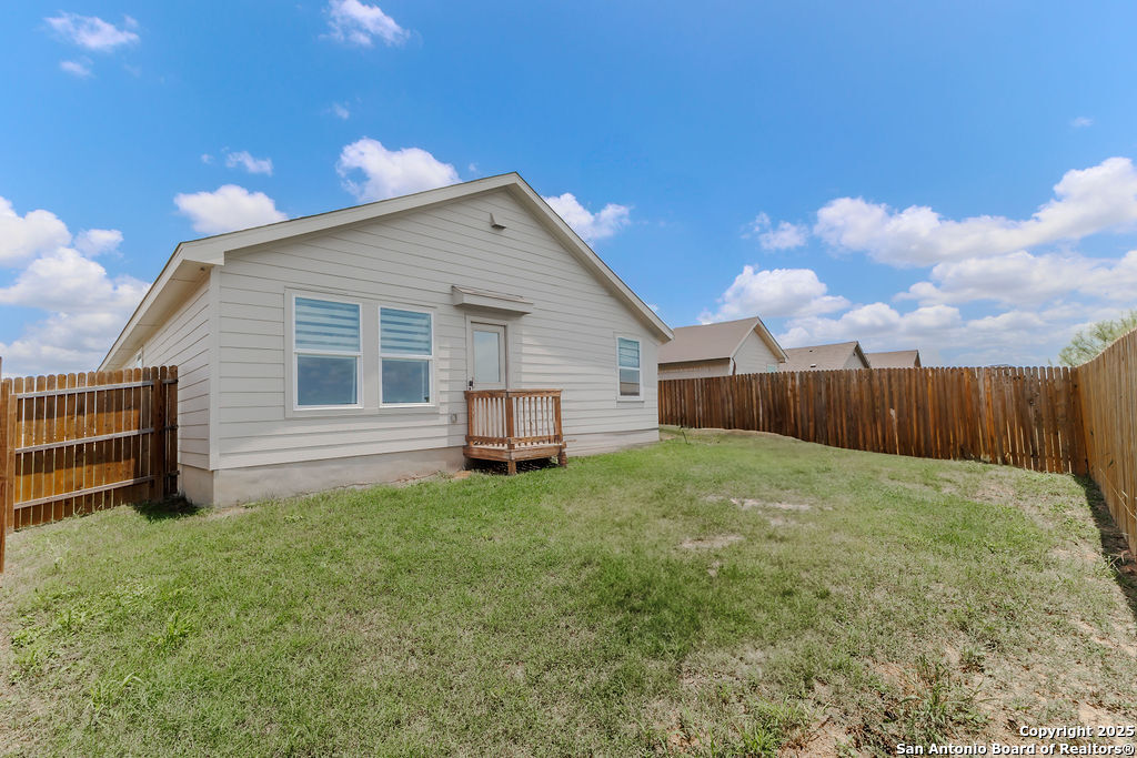 10502 Torroja Way Converse, TX 78109 - Photo 33 of 35 a view of a backyard with wooden fence