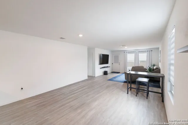 a workspace with furniture hardwood and a window