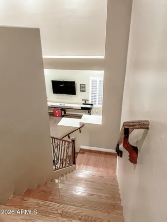 a living room with couch and wooden floor