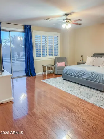 a view of a bedroom with furniture and windows