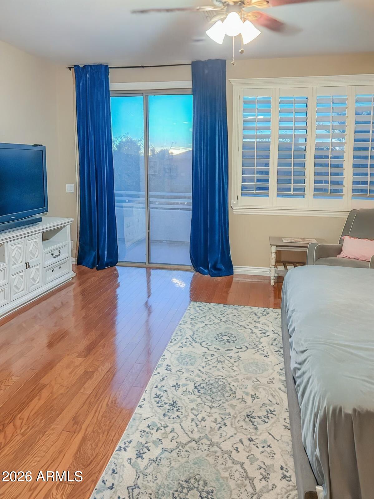 4450 South Rio Drive Chandler, AZ 85249 - Photo 18 of 29 a view of a bedroom with furniture and windows