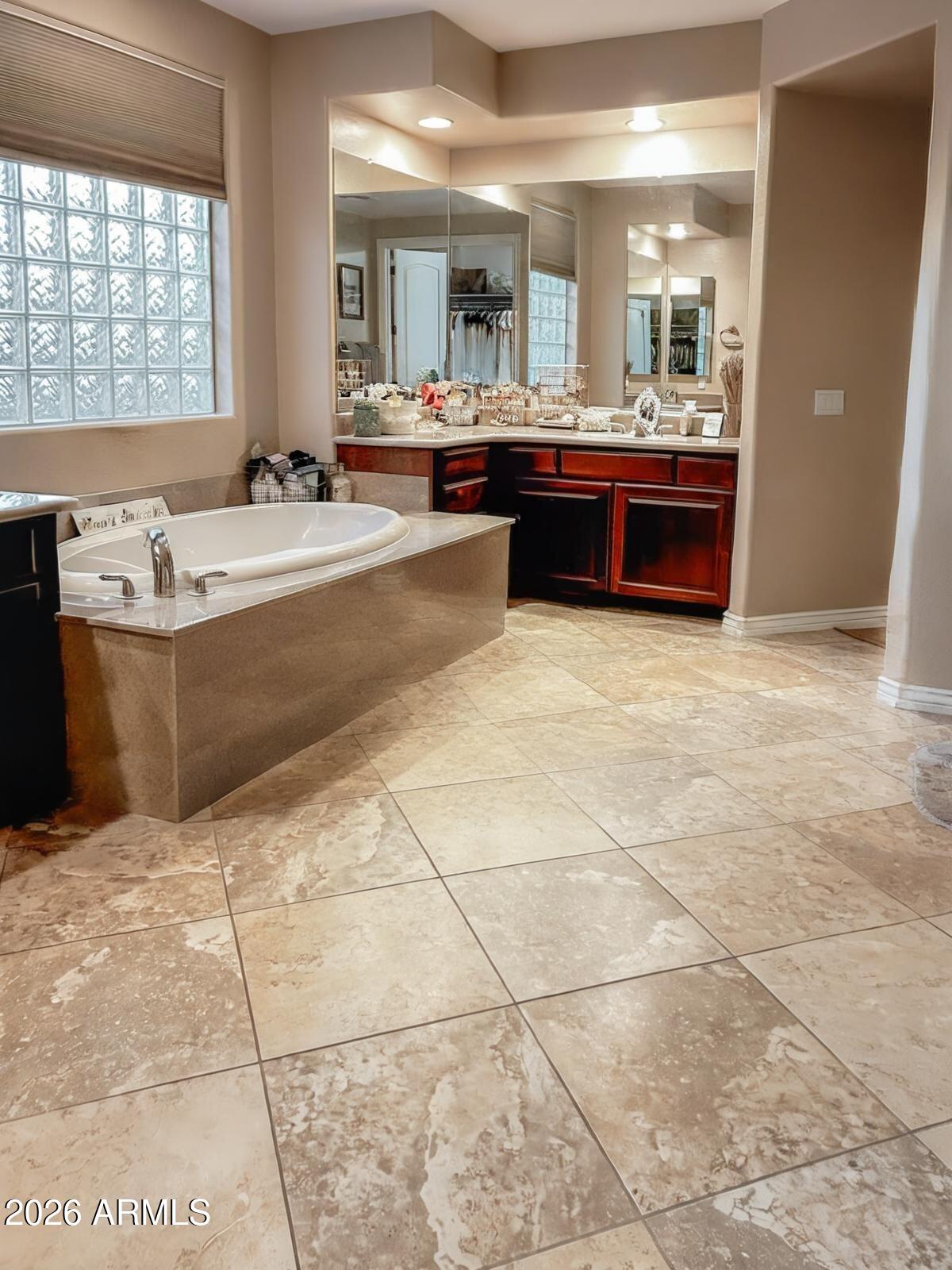 4450 South Rio Drive Chandler, AZ 85249 - Photo 20 of 29 a large bathroom with a tub and sink