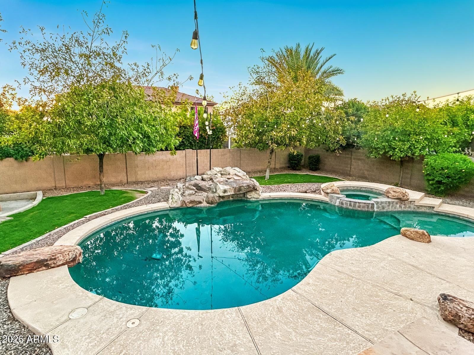 4450 South Rio Drive Chandler, AZ 85249 - Photo 27 of 29 a view of a swimming pool with a patio
