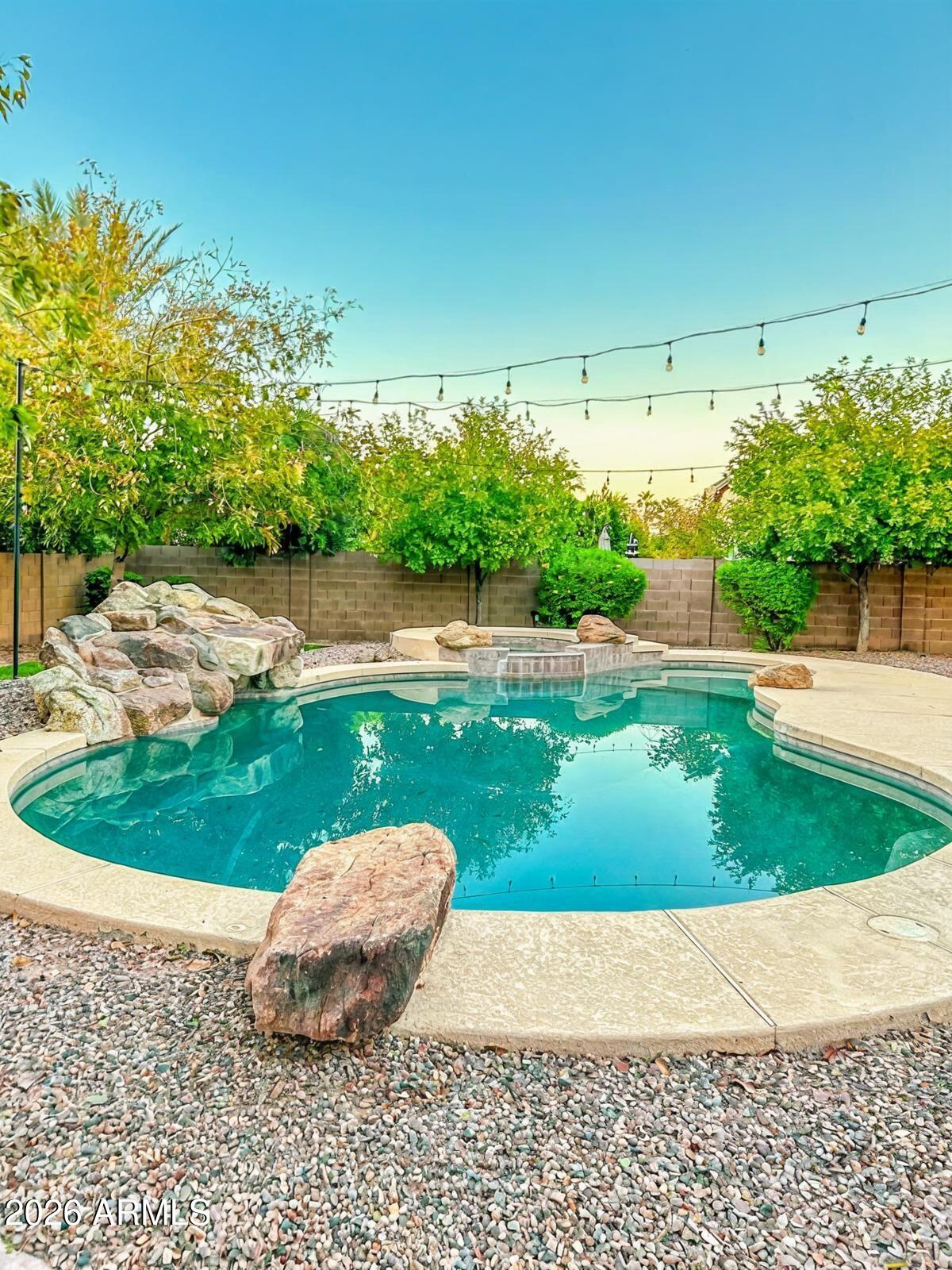 4450 South Rio Drive Chandler, AZ 85249 - Photo 28 of 29 a wooden floor with a yard and trees in the back
