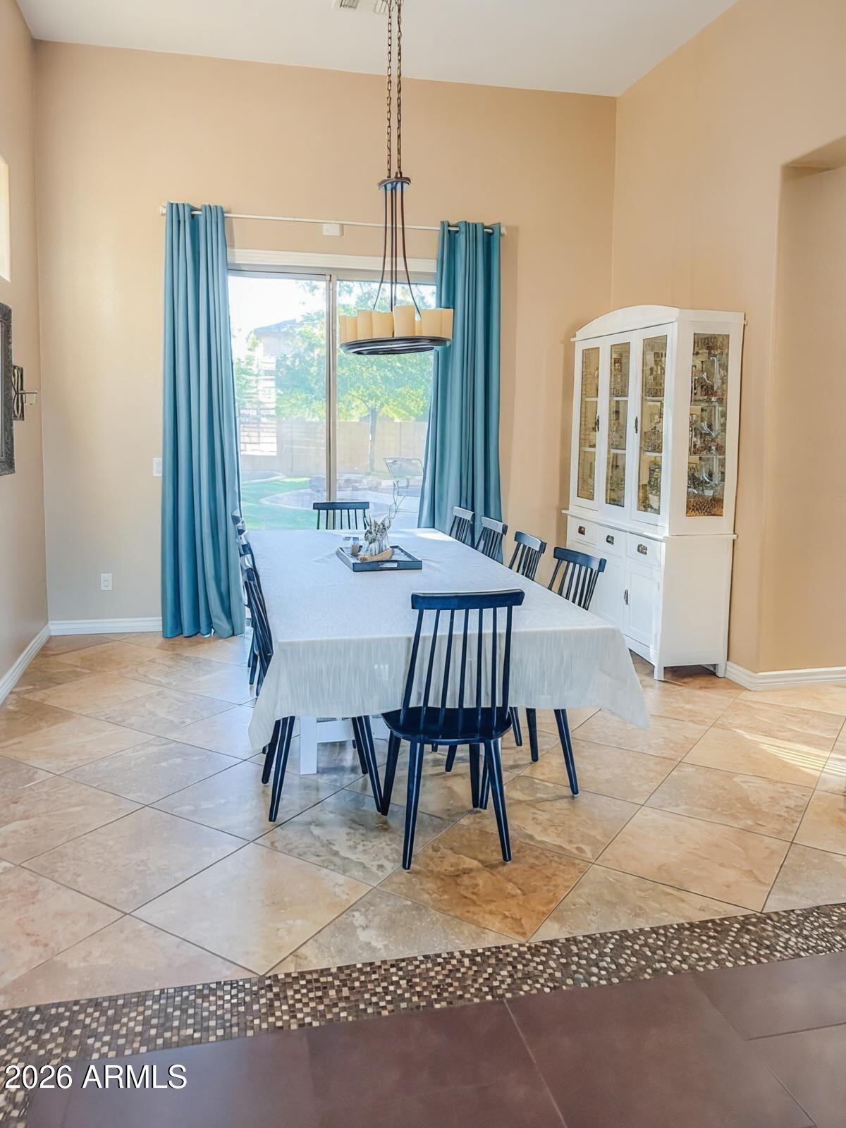 4450 South Rio Drive Chandler, AZ 85249 - Photo 5 of 29 a view of a dining room with furniture window and outside view