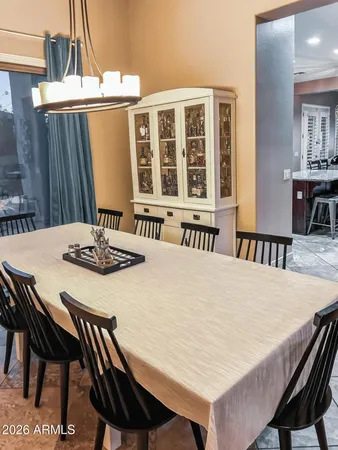 a kitchen with a table and chairs in it