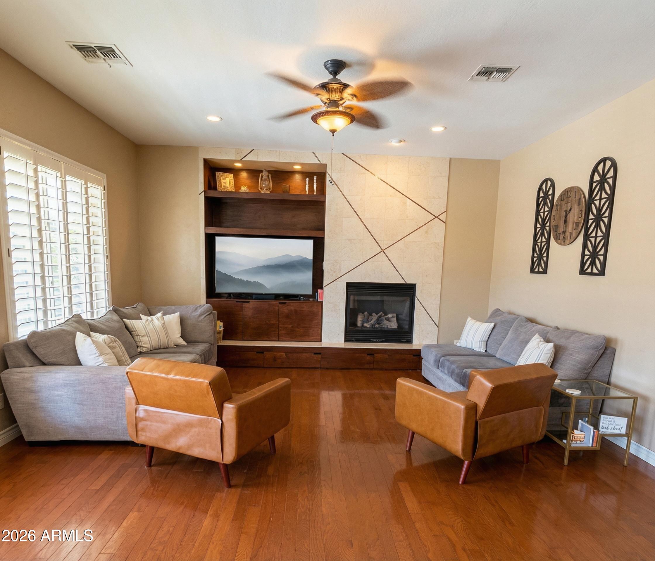 4450 South Rio Drive Chandler, AZ 85249 - Photo 9 of 29 a living room with furniture and a fireplace