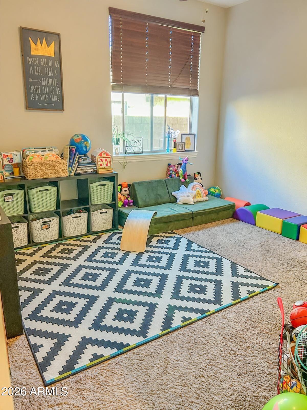 4450 South Rio Drive Chandler, AZ 85249 - Photo 10 of 29 a view of a bedroom with a bed and toys