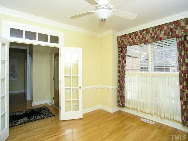 7413 Fontana Ridge Lane Raleigh, NC 27613 - Photo 6 of 25 This is the formal dining room although previous owners installed the french doors and used it as an office space. Very private