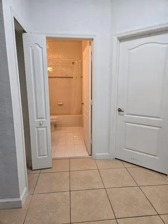 a stove top oven sitting inside of a kitchen