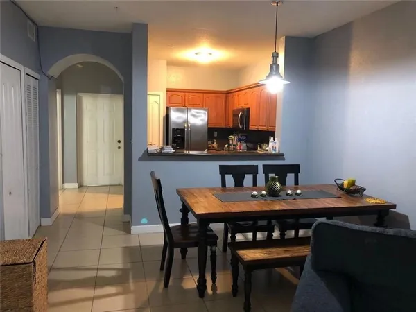 a view of a dining room with furniture and a rug