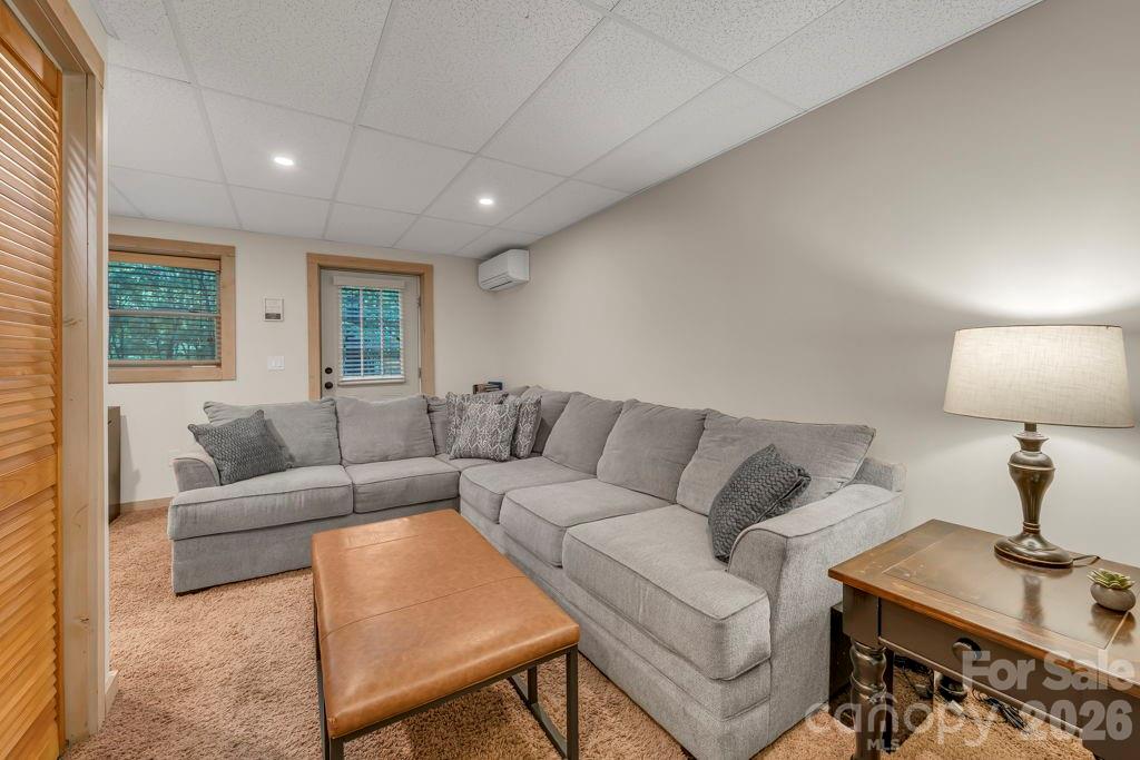 192 Dewitt Barnett Road, Unit 2 Vilas, NC 28692 - Photo 26 of 32 a living room with furniture and a lamp