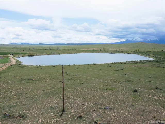 a view of a lake with a big yard
