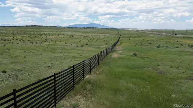 a view of a field with an outdoor space