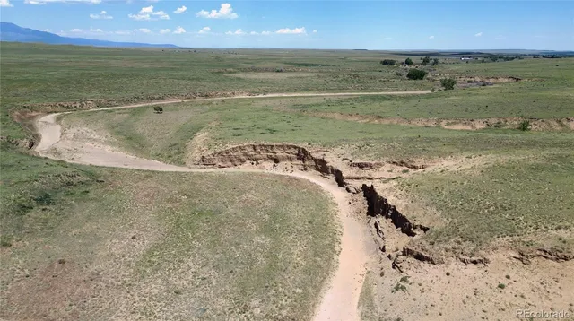a view of a field with an outdoor space