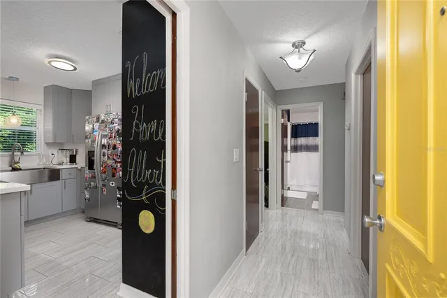 a view of a hallway and dining room
