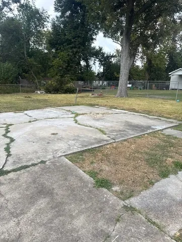 a view of a yard with swimming pool