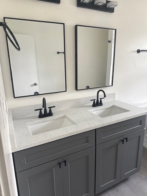 4517 Hirsch Road Houston, TX 77026 - Photo 7 of 11 a bathroom with a sink and a mirror