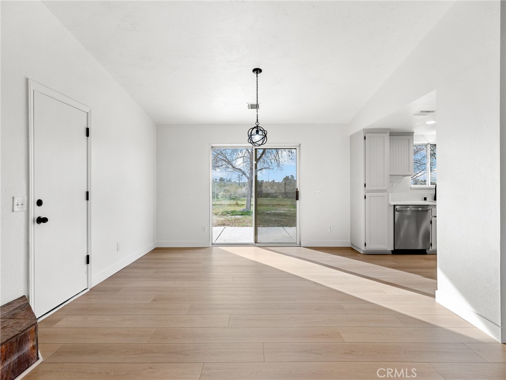 12780 Hacienda Road Phelan, CA 92371 - Photo 12 of 38 a view of an empty room with a window