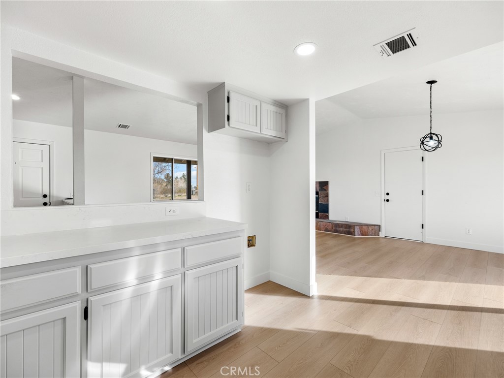 12780 Hacienda Road Phelan, CA 92371 - Photo 15 of 38 a view of a kitchen with a sink