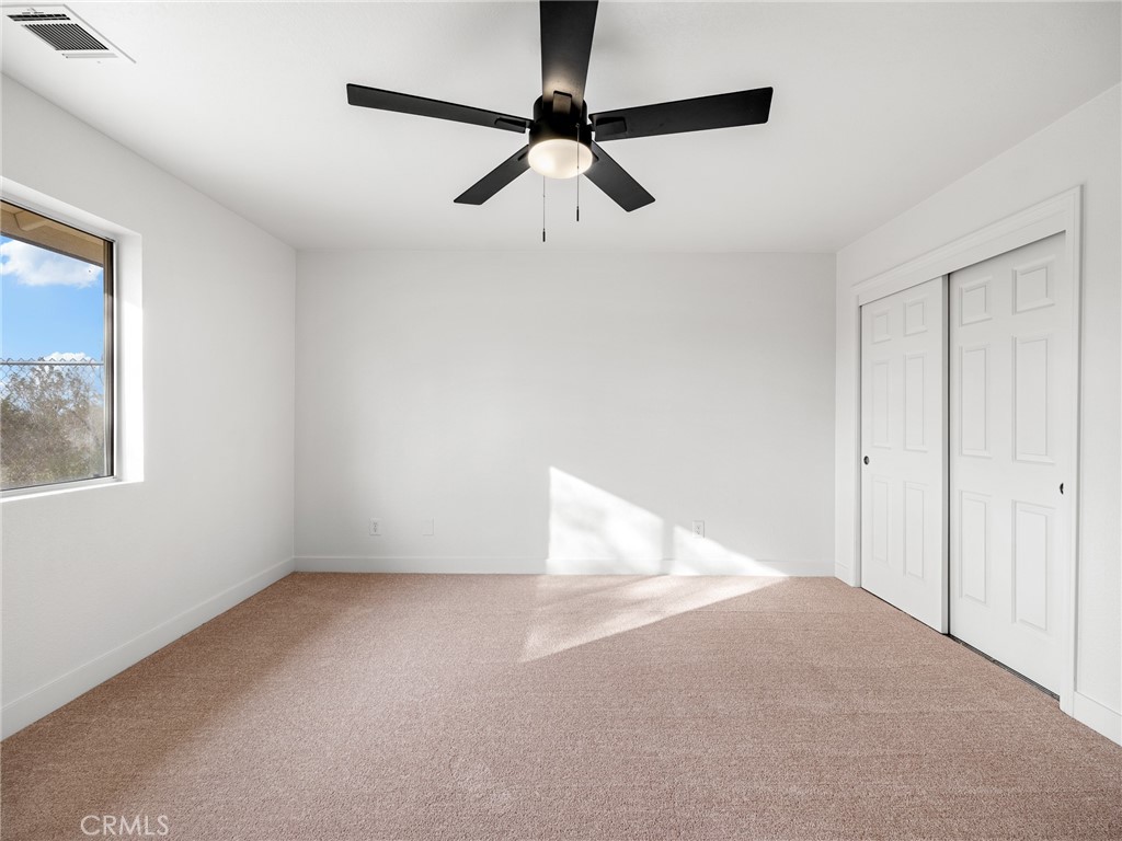 12780 Hacienda Road Phelan, CA 92371 - Photo 21 of 38 a view of an empty room with a window
