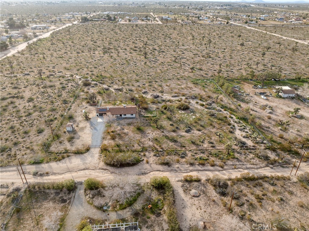 12780 Hacienda Road Phelan, CA 92371 - Photo 35 of 38 an aerial view of residential houses with outdoor space