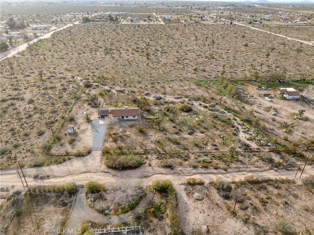 12780 Hacienda Road Phelan, CA 92371 - Photo 35 of 38 an aerial view of residential houses with outdoor space