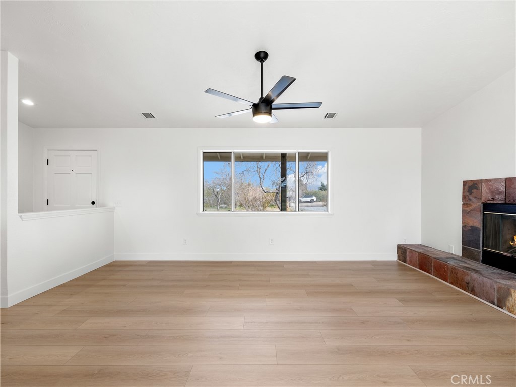 12780 Hacienda Road Phelan, CA 92371 - Photo 7 of 38 a view of empty room with wooden floor