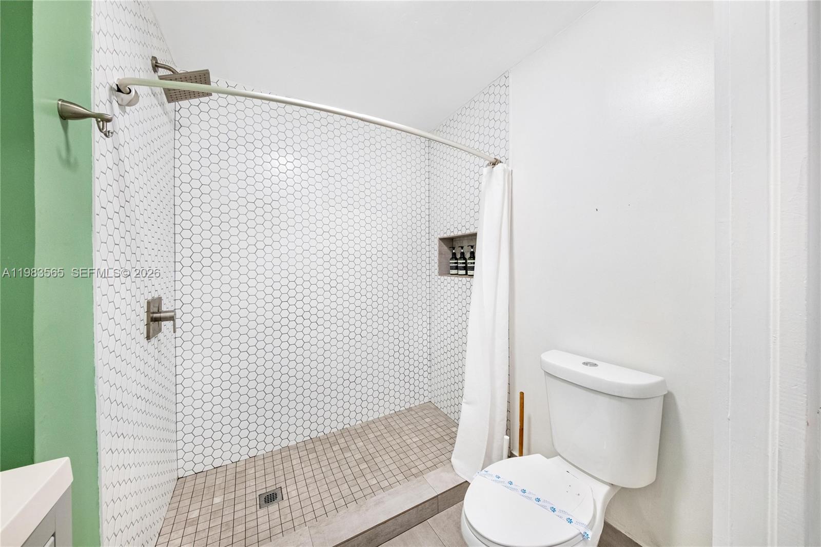 237 38th Street, Unit 4 Miami Beach, FL 33140 - Photo 13 of 28 a bathroom with a toilet and a shower