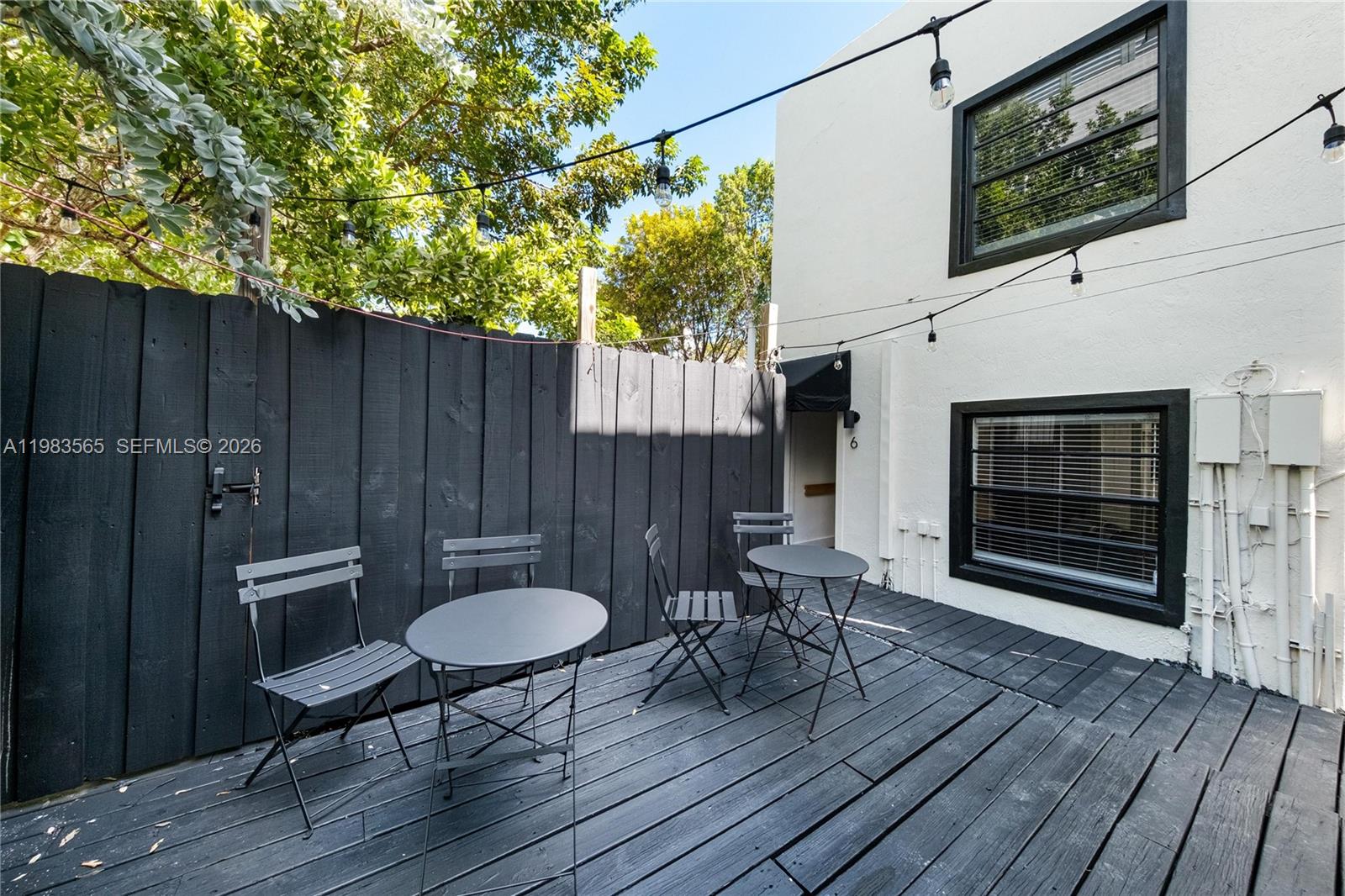 237 38th Street, Unit 4 Miami Beach, FL 33140 - Photo 16 of 28 a balcony with table and chairs