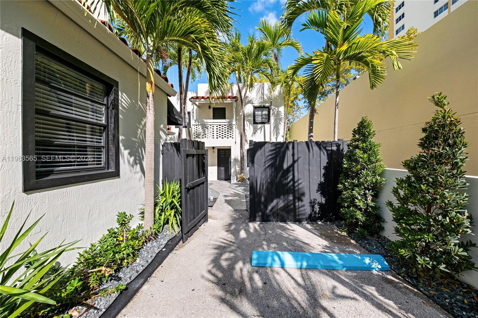 237 38th Street, Unit 4 Miami Beach, FL 33140 - Photo 18 of 28 a view of a back yard of the house