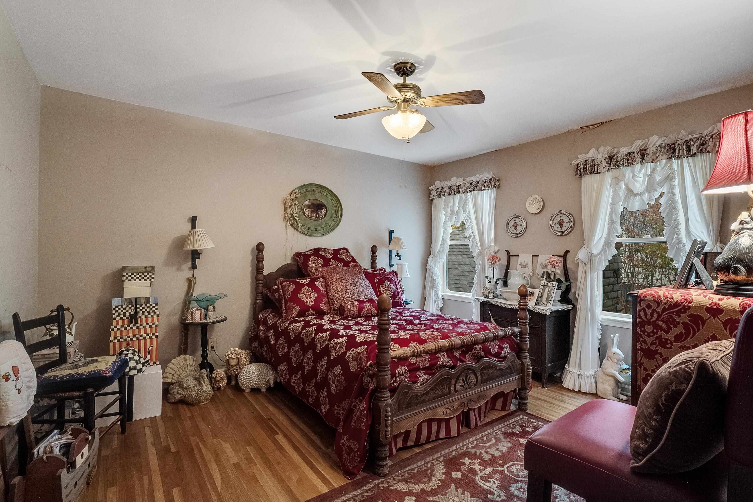 5302 Dee Road Memphis, TN 38117 - Photo 13 of 18 a bedroom with a bed and wooden floor