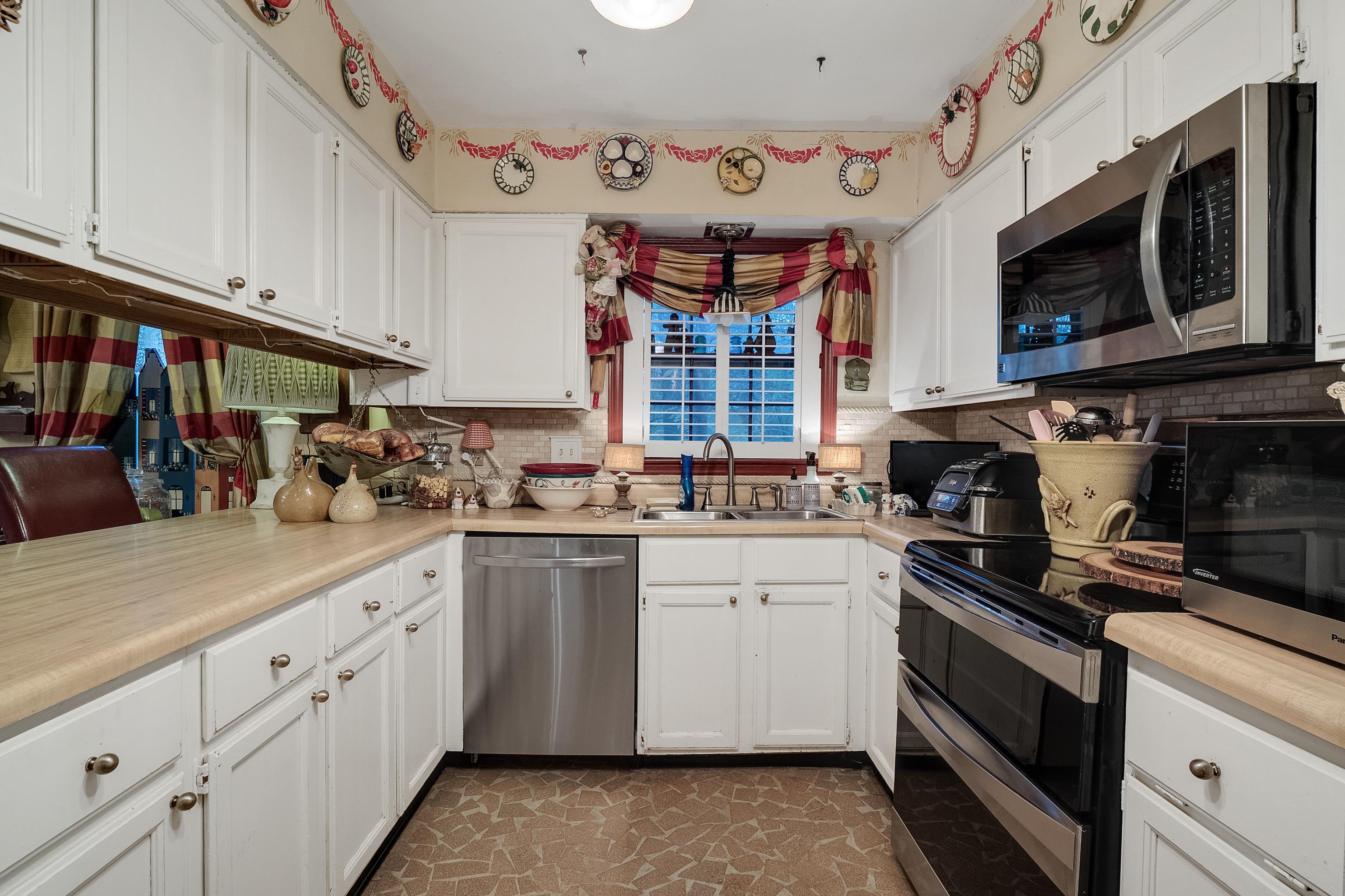5302 Dee Road Memphis, TN 38117 - Photo 8 of 18 a kitchen with a sink cabinets and window