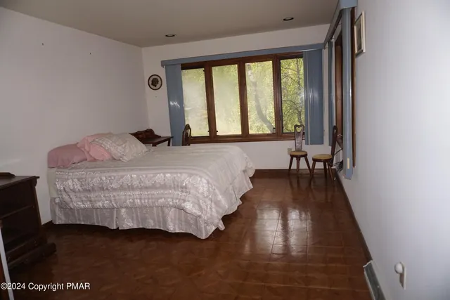 a bathroom with a tub a sink and mirrors