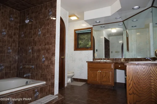 a bathroom with a glass shower door