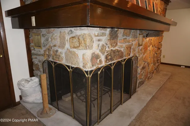 a bedroom with furniture and a book shelf