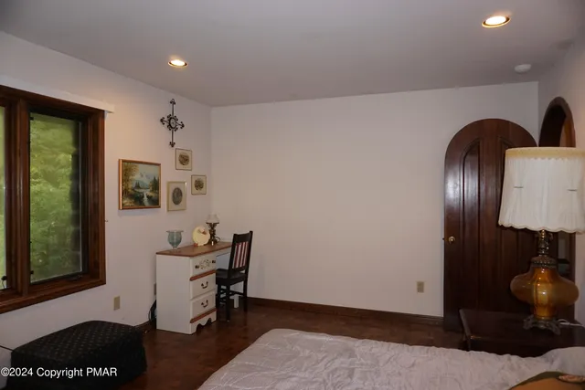a bedroom with a bed and cabinets