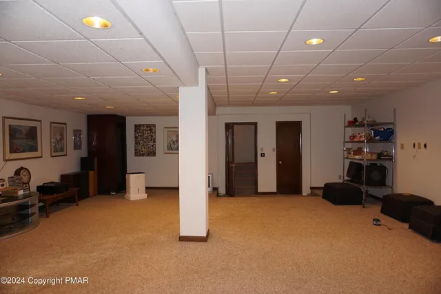 a spacious bathroom with a tub sink and mirror