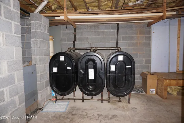 a bedroom with bed and furniture