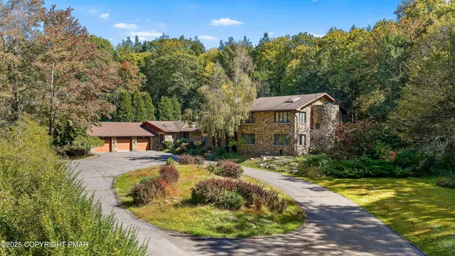 a view of living room with furniture and chandelier
