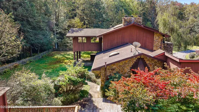 a view of gym equipment with wooden floor